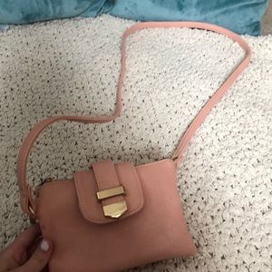 Charming Charlie’s pink cross body bag